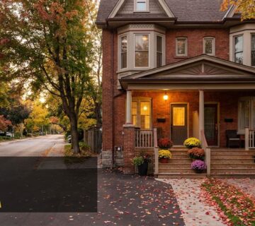 Toronto semi detached brick house with a front porch in autumn
